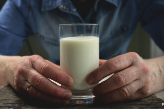 alt="a glass of milk"