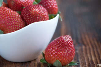 alt= "strawberry in a white bowl"