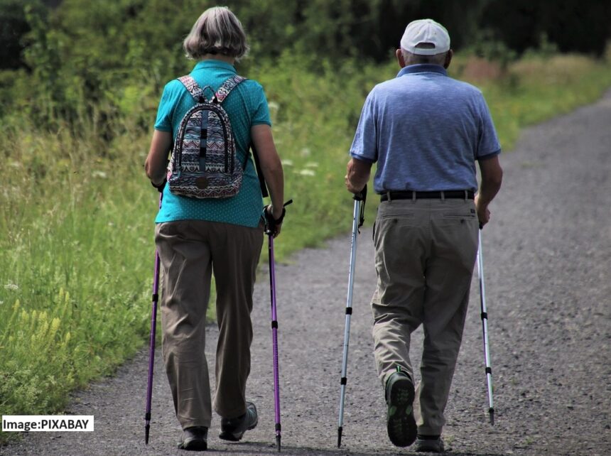 alt="old couple walking"