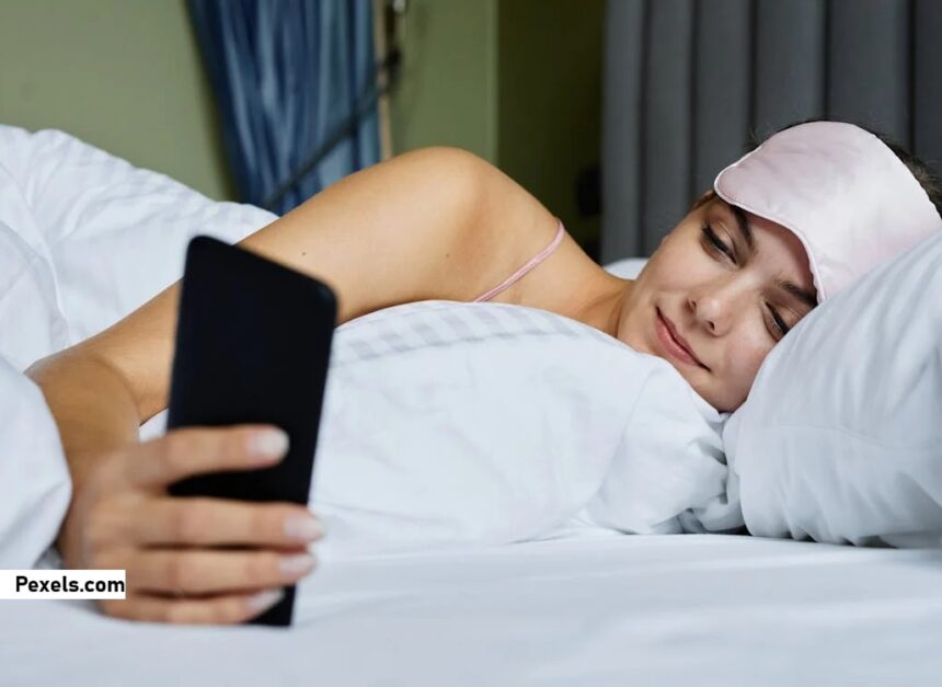 alt="smartphone screen use on bed"