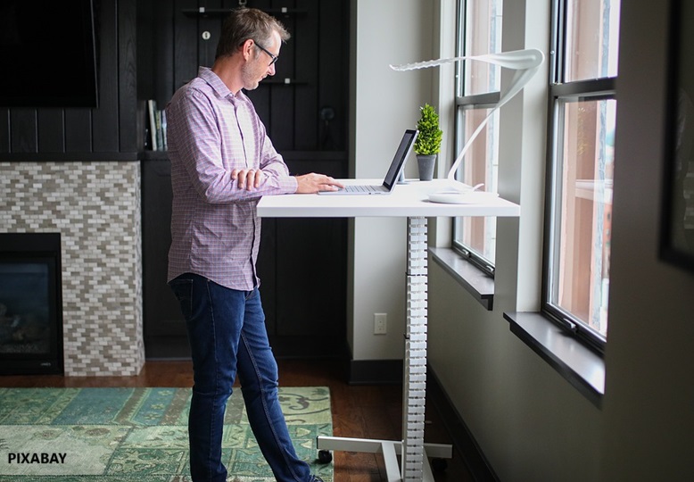 alt="standing desk job"