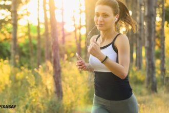 alt="woman jogging exercise"