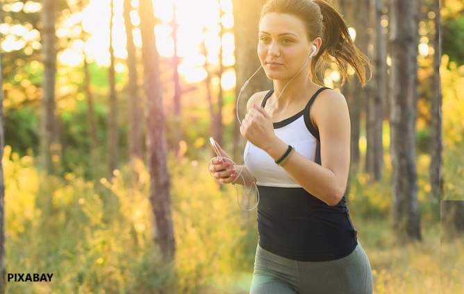 alt="woman jogging exercise"